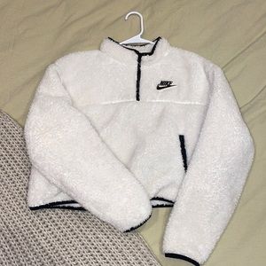 Cropped white Nike 1/4 zip fuzzy sweater.